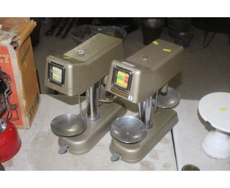 Two Omal Universal money checker scales