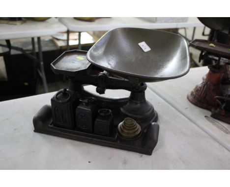 A set of shop scales with original weights