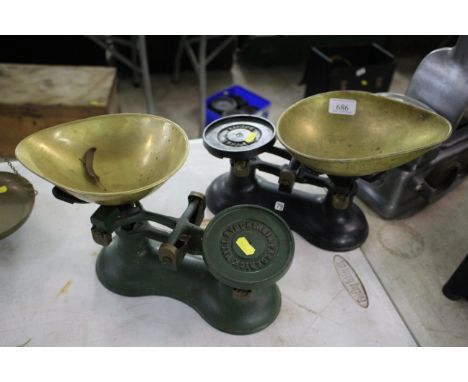 Two sets of small domestic scales with brass pans