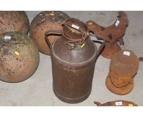 A metal churn with twin handles and lid 