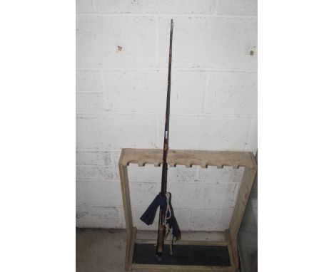 A Hardy of Alnwick two piece fishing rod with bag