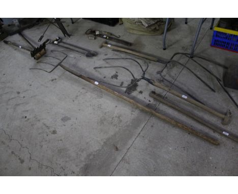 A long handled four pronged fork 