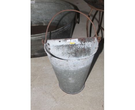 A bucket wall planter with swing handle 