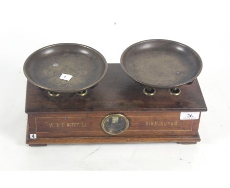 A wooden and brass W &amp; T Avery Ltd. of Birmingham set of balance counters scales