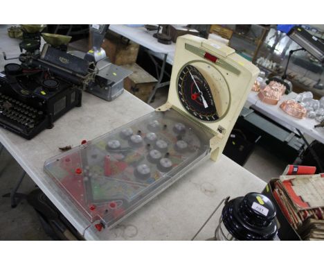 A vintage table top pinball machine 