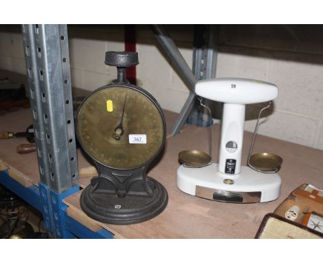 A brass faced Salter Family balance scale with no tray and a small Avery set of balance shop scales to weigh 50gms