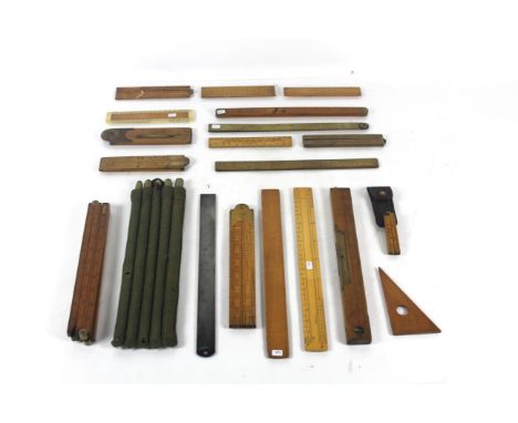 A boxwood scale rule with brass hinges, a Rabone 3ft four fold ruler with brass arched joint, set of five gauging rods for ba