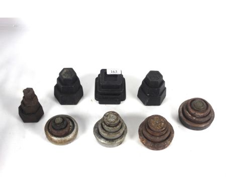 A large quantity of various shaped cast iron scale weights