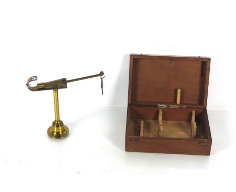 A brass travelling set of scales with wooden travelling box