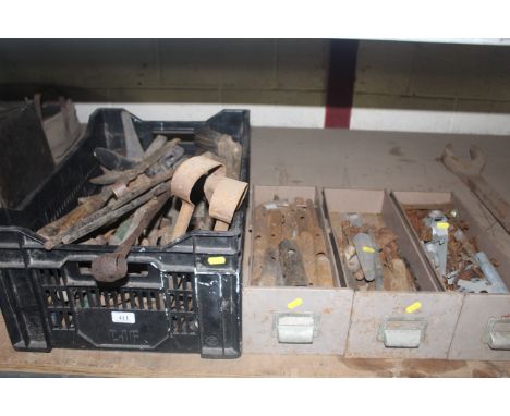 A large plastic crate of hand tools and three metal drawers of tools 
