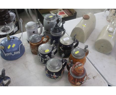 Nine ceramic and decorative beer Steins with metal lids 