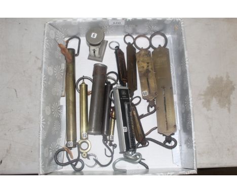 A box containing various cylinder and other balance scales 