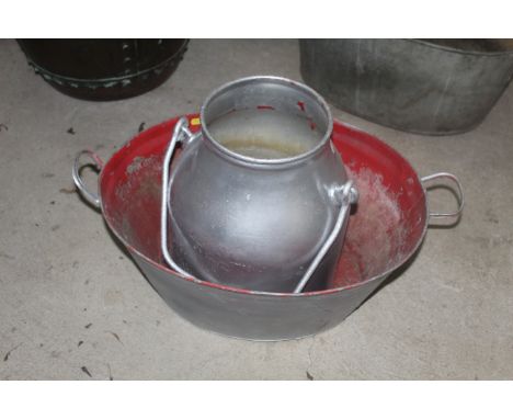 A galvanised bath and a stainless steel milk churn with swing handle 