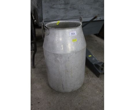 An aluminium churn with handle and no lid 