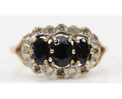A 9ct gold vintage oval cut sapphire and diamond dress ring, Q, 2.3g 