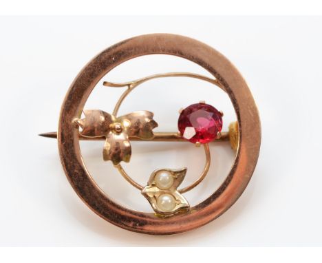 A 9ct rose gold antique Art Nouveau ruby paste and seed pearl brooch, 24mm diameter, 1.7g 