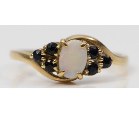 A 9ct gold opal and sapphire dress ring, K, 1.3g 