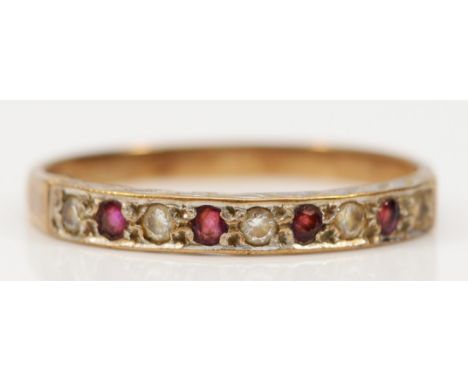 A 9ct gold vintage ruby and cubic zirconia half eternity ring, T, 1.6g 