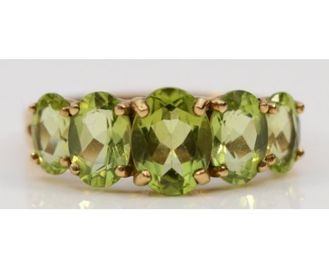A 9ct gold five stone Peridot dress ring, claw set, R, 2.8g 