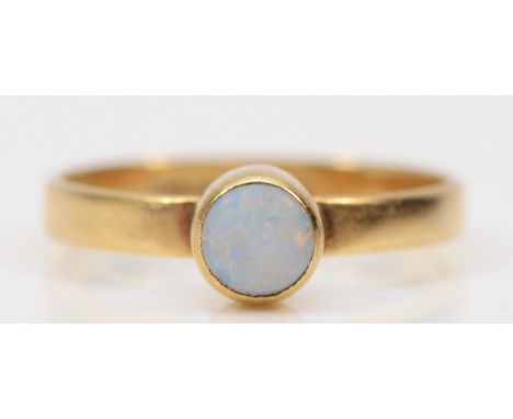 A 9ct gold bezel set opal solitaire ring, E, 0.9g 