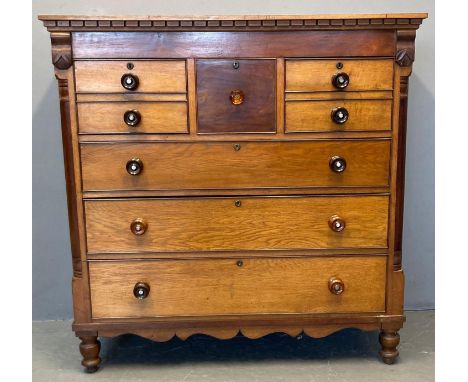 Victorian oak Scotch chest of drawers, the moulded and dental cornice above an arrangement of four short and three long drawe
