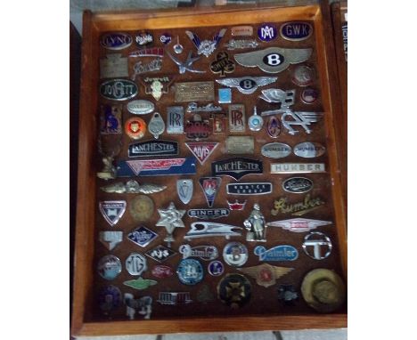 A good glazed case containing a collection of assorted British vehicle badges, various, enamel and others to include: Clyno, 