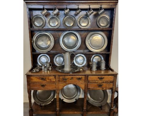 Collection of 18th/19th century pewter items to include: chargers, plates, pot bellied and other tankards, chamber sticks, Ja