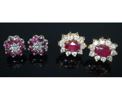 Pair of 18ct gold diamond and ruby earrings, the central ruby surrounded by ten diamonds, together with another pair of red a