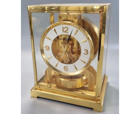 20th century Jaeger-Le-Coultre 'Atmos' clock, having gilt brass five glass case, Arabic chapter ring on bracket supports.  Ov