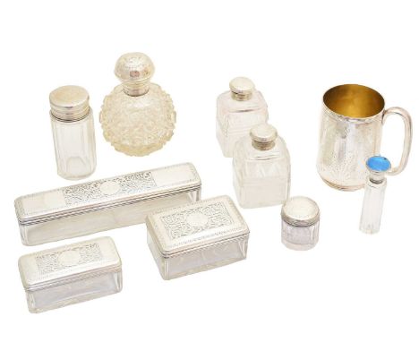 A large selection of silver, to include silver lidded pots, silver lidded jars, a silver and enamel lidded scent bottle, and 