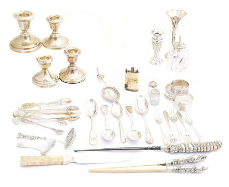 A large selection of silver, to include silver candlesticks, silver vases, silver flatware, silver napkin rings etc, gross we