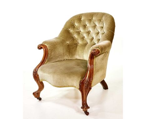 Victorian walnut framed deep-button armchair, spoon back with scroll arms, sprung seat, serpentine front rail, brass and pot 