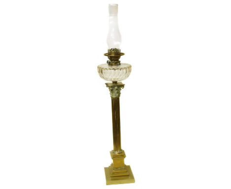 A Victorian brass oil lamp, cut glass reservoir supported on Corinthian Column with a stepped square base.height 73cm (29in)C