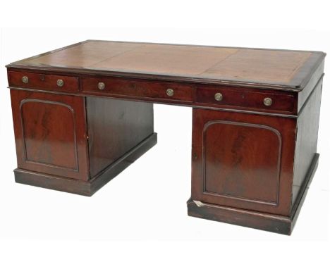 A late Victorian mahogany Partners desk, with a gilt-tooled edge leather skiver over an arrangement of three frieze drawers, 