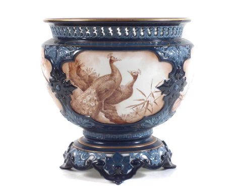 Hadley’s Worcester jardiniere, painted with peacocks in sepia, with turquoise moulded borders, with pierced border. 19cm diam