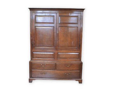 18th-century oak livery cupboard, the upper section with two doors, each with two raised and fielded panels covering interior