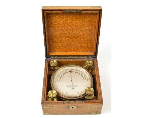 Compensated aneroid barometer by Redding &amp; Co. London with vernier showing 0 to 7000, feet all contained in light oak tra