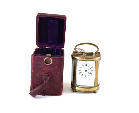 Early 20th-century carriage clock, 8-day movement, white enamel dial with Roman numerals, oval section case with brass frame 