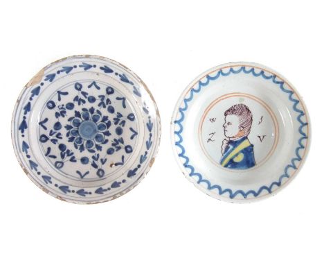 Two small Delft plates, one painted with a portrait of King William the other with a formal blue floral device, late 17th / 1