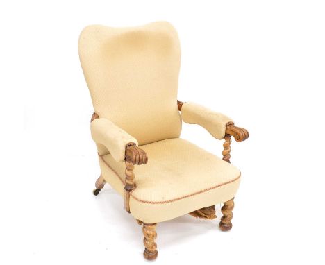William IV walnut framed armchair, upholstered seat, open arms carved with acanthus leaves and scrolling terminals, sprung se