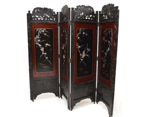 Late 19th-century Japanese four-leaf room divider, the ebonised frame with carved and pierced decoration depicting flowers an