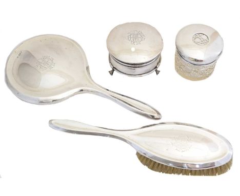 A selection of silver, to include a silver backed brush, silver backed mirror, silver trinket box and silver lidded jar (4). 