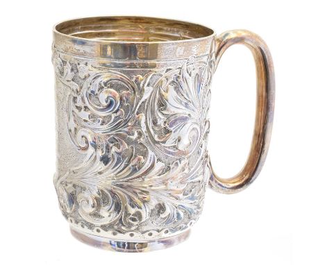 An Edward VII silver tankard, with embossed scrolling decoration and central cartouche bearing inscription dated 1906, hallma