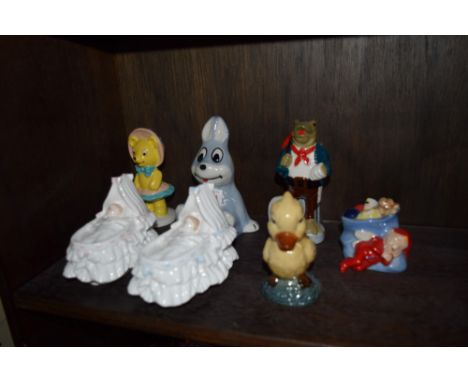 Five Wade collector's figures; together with two Royal Worcester figures of 'New Arrival'. 