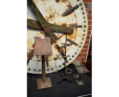 A mixed lot, comprising: a tripod test tube stand; a pair of steel stands; and an oak lecturn. 