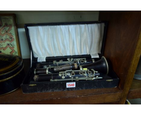A hardwood and nickel plated clarinet, in box. 
