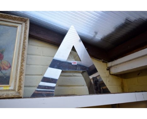 An oversize aluminium letter 'A', with concealed light to the reverse, 45.5cm high.