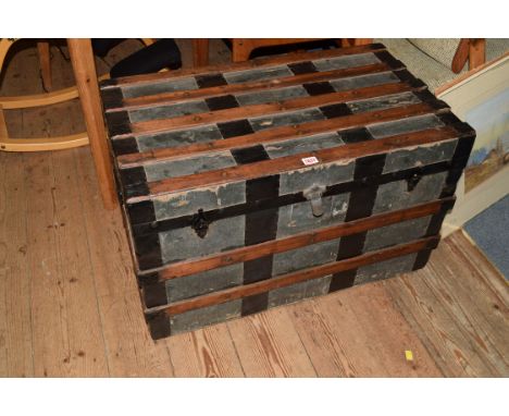 A Victorian canvas and wood bound trunk, with pasted 'London Brighton & South Coast Railway, Victoria to Selsey' label, 81cm 