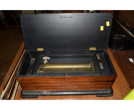 A late 19th century Swiss rosewood and inlaid cylinder music box, playing eight airs, with lever wind and 10¾ inch cylinder, 
