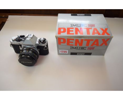A Pentax ME Super 35mm camera, boxed with instructions, with 1:17 50mm lensm Speedtron flashlight and related.